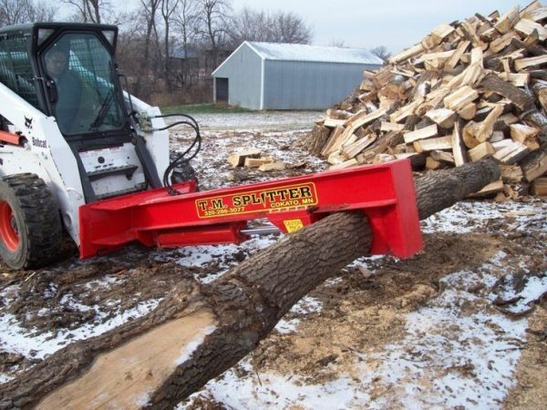 tm_pro_carrying_log.jpg TM Pro Log Splitter Skid Steer Attachment (24”, 30” or 36” Stroke)